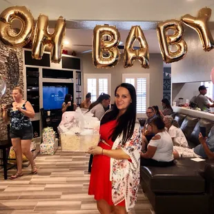 Momma to be holding her gift basket!