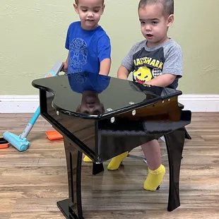 Cute little performing stage with a piano and drum