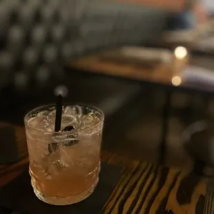 The Noble Experiment with four roses, plum, black cherry, club soda, fresh sours, and luxardo cherry.