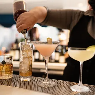 a bartender pouring a drink