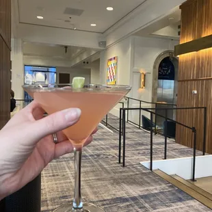 a hand holding a glass