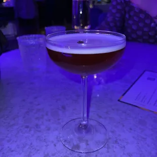 a glass of wine on a table