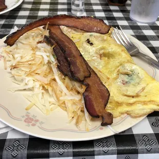 an omelet with bacon and hash browns