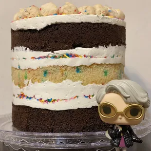 Cake next to a Miranda Priestly funko pop for scale and because Teresa the owner is a BOSS.