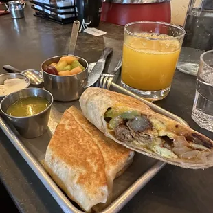 Breakfast burrito with veggie sausage and fresh squeezed orange juice