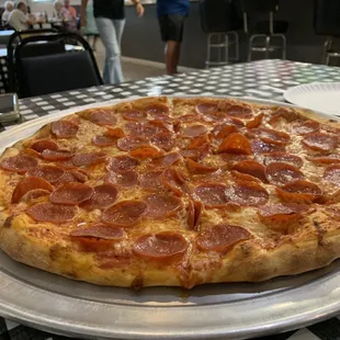 Dining room with large pepperoni pizza!