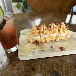 Deviled eggs and strawberry mojito