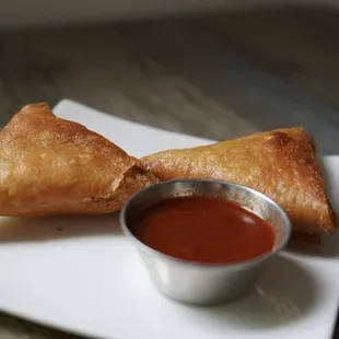 Lentil &amp; Chicken Sambusas served with a delicious house sauce.