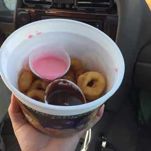 Donuts with chocolate and strawberry dipping sauce