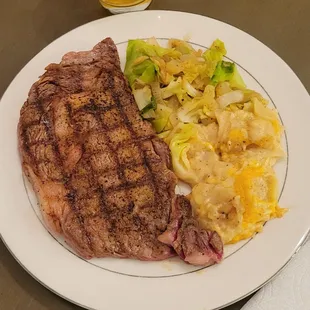 a plate of meat and vegetables