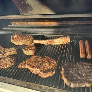 Tomahawk, Ribeye, filet, and hotdogs