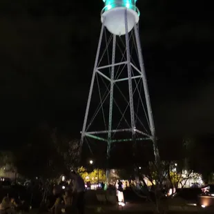 a water tower at night