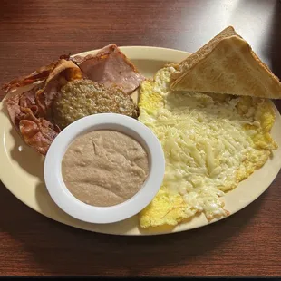 #2  2 eggs any style substituted the hashbrowns for beans. Bacon, ham or sausage. Ordered 2 of each.