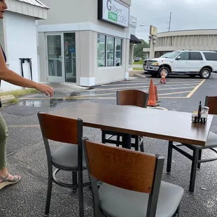 View of outdoor dining and front door