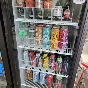 a refrigerator full of sodas