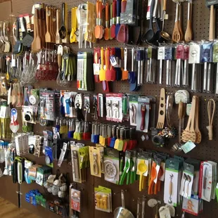 a wall of kitchen utensils