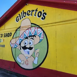 Side of Gilbertos by parking