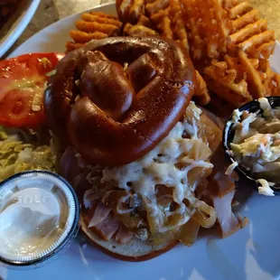Spinach artichoke turkey sandwich on pretzel bread