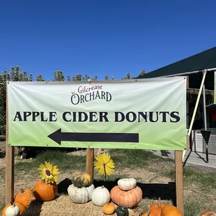A sign directing people where to find their famous donuts.