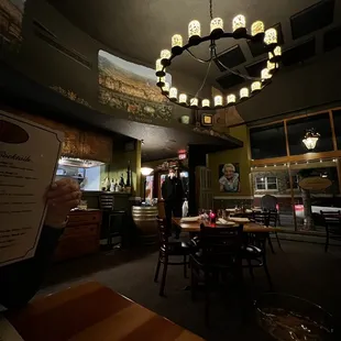 a person holding a menu