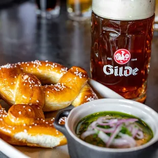 a plate of pretzels and a mug of beer