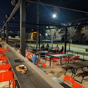 people sitting outside at night
