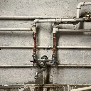 Laundry faucet replacement in basement on an old two bay laundry sink