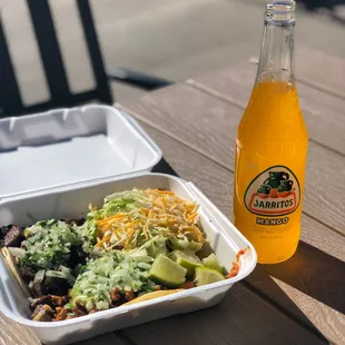 Tacos and mango Jarritos on the patio outside of Gilbertos
