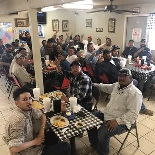 Customers enjoying their burgers and fries. We have a full kitchen to serve up your favorite dish.