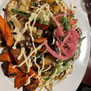 The "cabbage steak" - grilled cabbage ribbons with carrots, potatoes, green beans, pickled red onion. All cooked and seasoned perfectly.