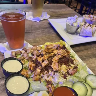Buffalo chicken salad and fried chicken wrap/baked potato salad.  And beer.....
