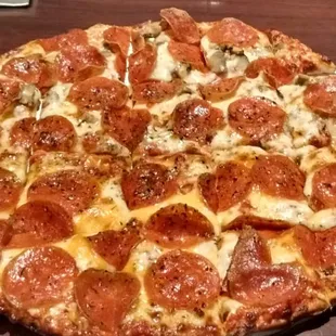 Five-Cheese and Pepperoni on one half, Mushroom and Pepperoni on the other.