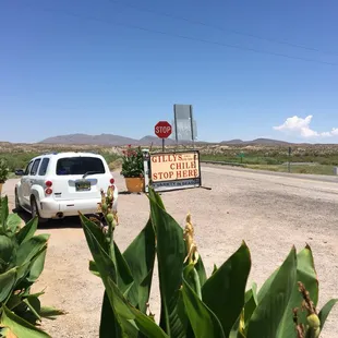 a stop sign and a car