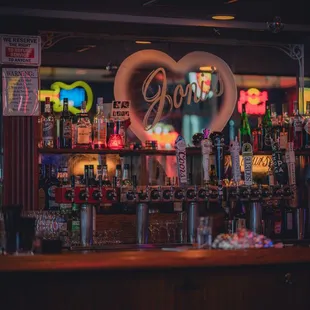 a bar with neon signs