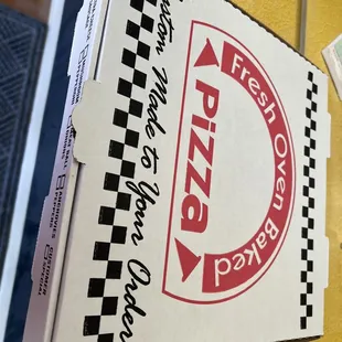 a pizza box with a pizza on it