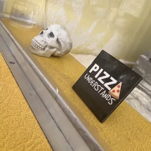 a skull on a window sill