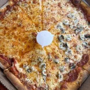 Half pepperoni and half pepperoni/black olives