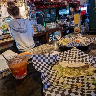 a woman sitting at a bar
