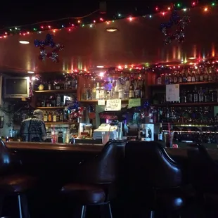 a bar with christmas lights