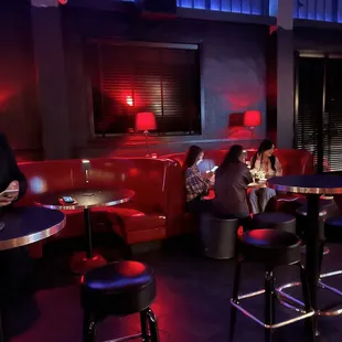 a group of people sitting at a bar