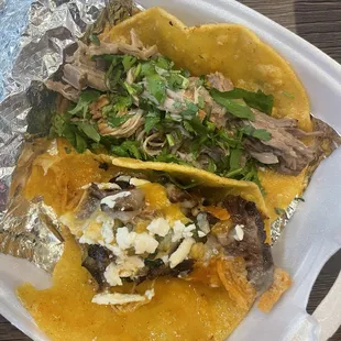 Brisket taco and carnitas taco