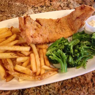 Fried cod dinner with fries and broccoli