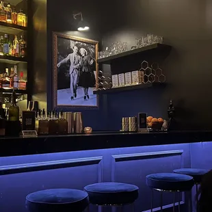 a bar with blue stools