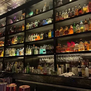 shelves of liquor and liquor glasses