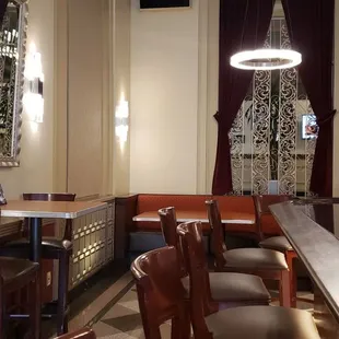 a view of a restaurant with tables and chairs