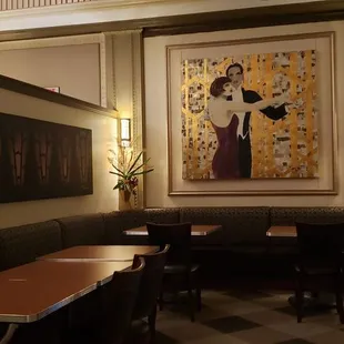 a dining area with tables and chairs