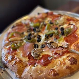 a pizza with pepperoni and olives