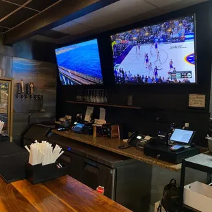 Bar area with stools to watch games.  Clean tables.