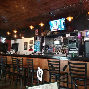 a bar with people sitting at it