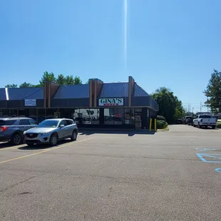 Gina's Cafe is on the corner of this large Business Plaza parking lot.   9/5/2024